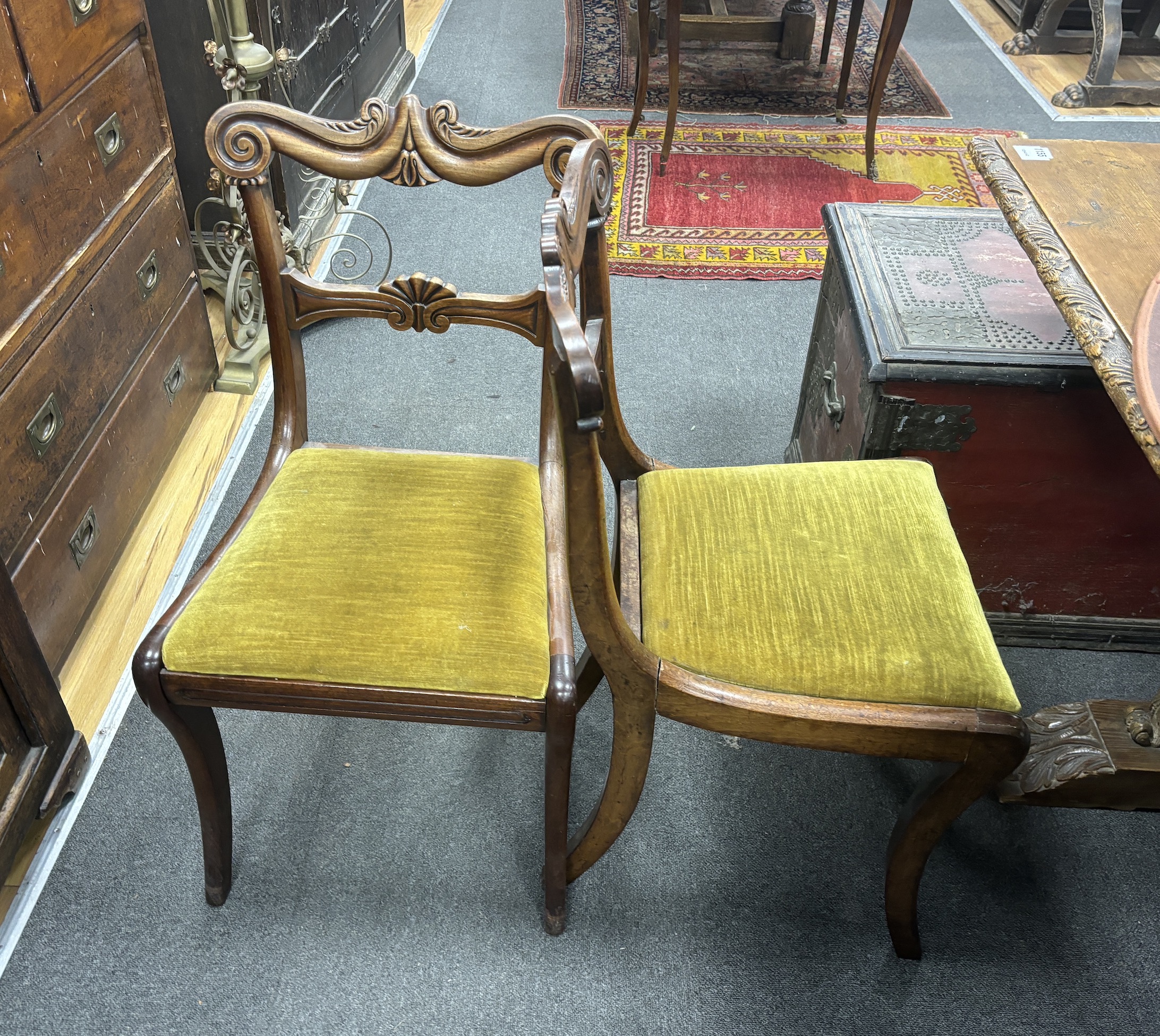 A set of six Regency mahogany sabre leg dining chairs